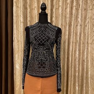 Form-fitting turtleneck in sheer